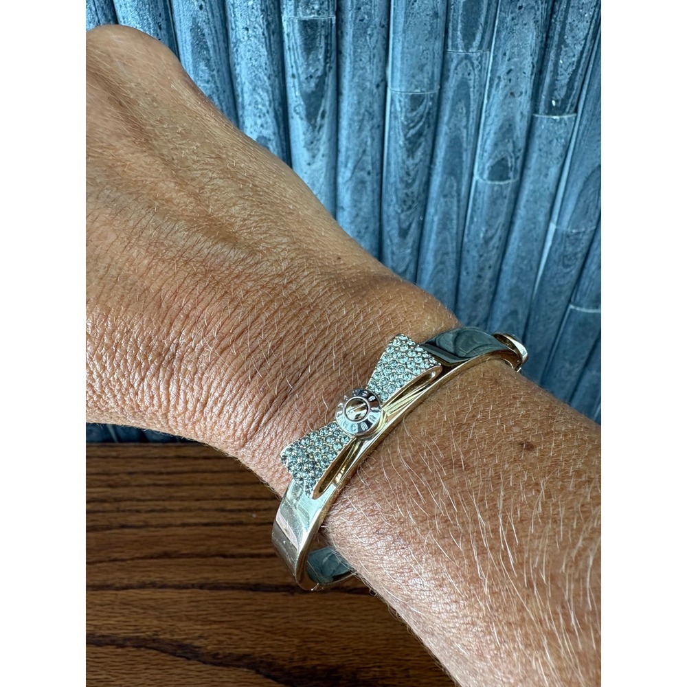 Henri Bendel Gold Tone Pave Crystal Bow Hinged Bangle Bracelet